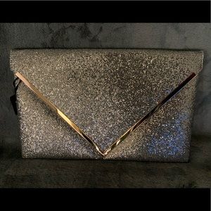 New sequence silver purse with gold trimming.